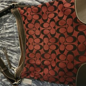 Coach Burgandy and Black Shoulder Bag with Signature Monogram.
